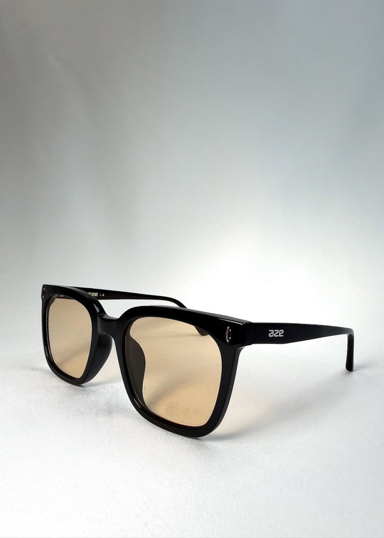 Angled front view of Cavalin Pitchline showing its square frame and vintage-inspired yellow lenses. 