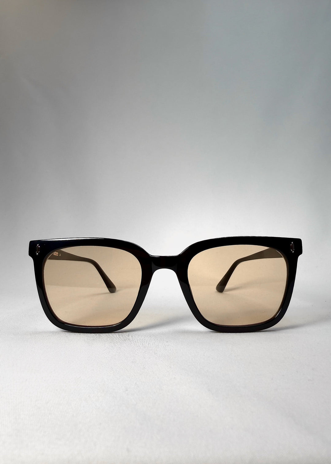 Front view of Cavalin Pitchline sunglasses with matte black frame and warm yellow-tinted lenses. 