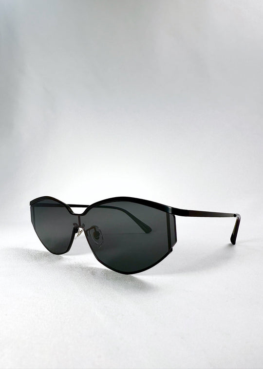 Angled front view of Celestia – Matte Black displaying the wide semi-rimless silhouette and minimalist matte finish. 