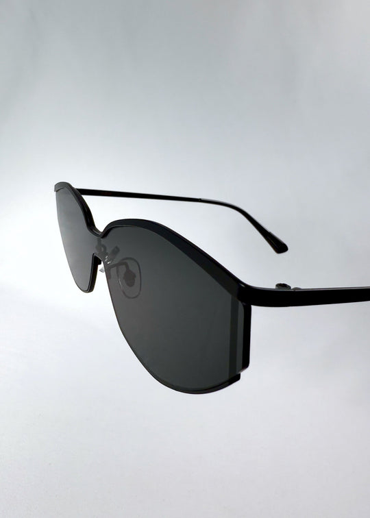 Close-up of Celestia – Matte Black’s HD nylon lenses, emphasizing the smoky tint and edge finishing.