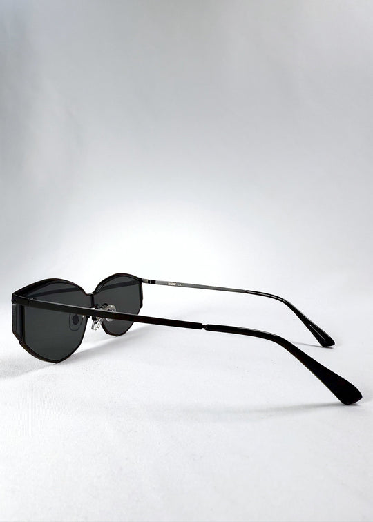 Side view of Celestia – Matte Black sunglasses highlighting the ultra-thin metal temples and ergonomic curve. 