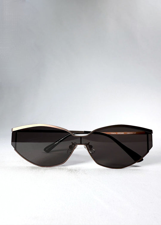 Front view of the Celestia – Mocha Bronze sunglasses with folded temples, emphasizing the wide HD nylon lenses and modern semi-rimless design. 