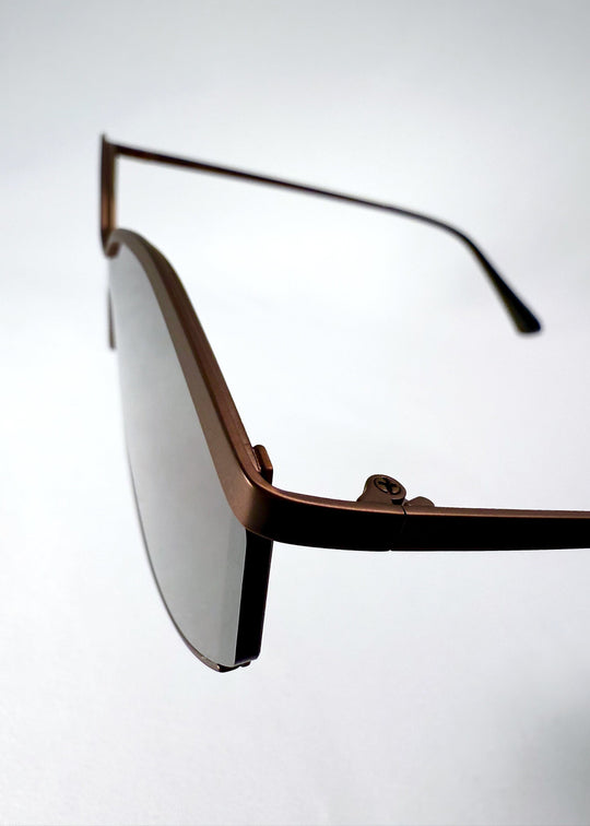 Close-up of the Celestia – Mocha Bronze lens and bronze semi-rimless frame finish. 