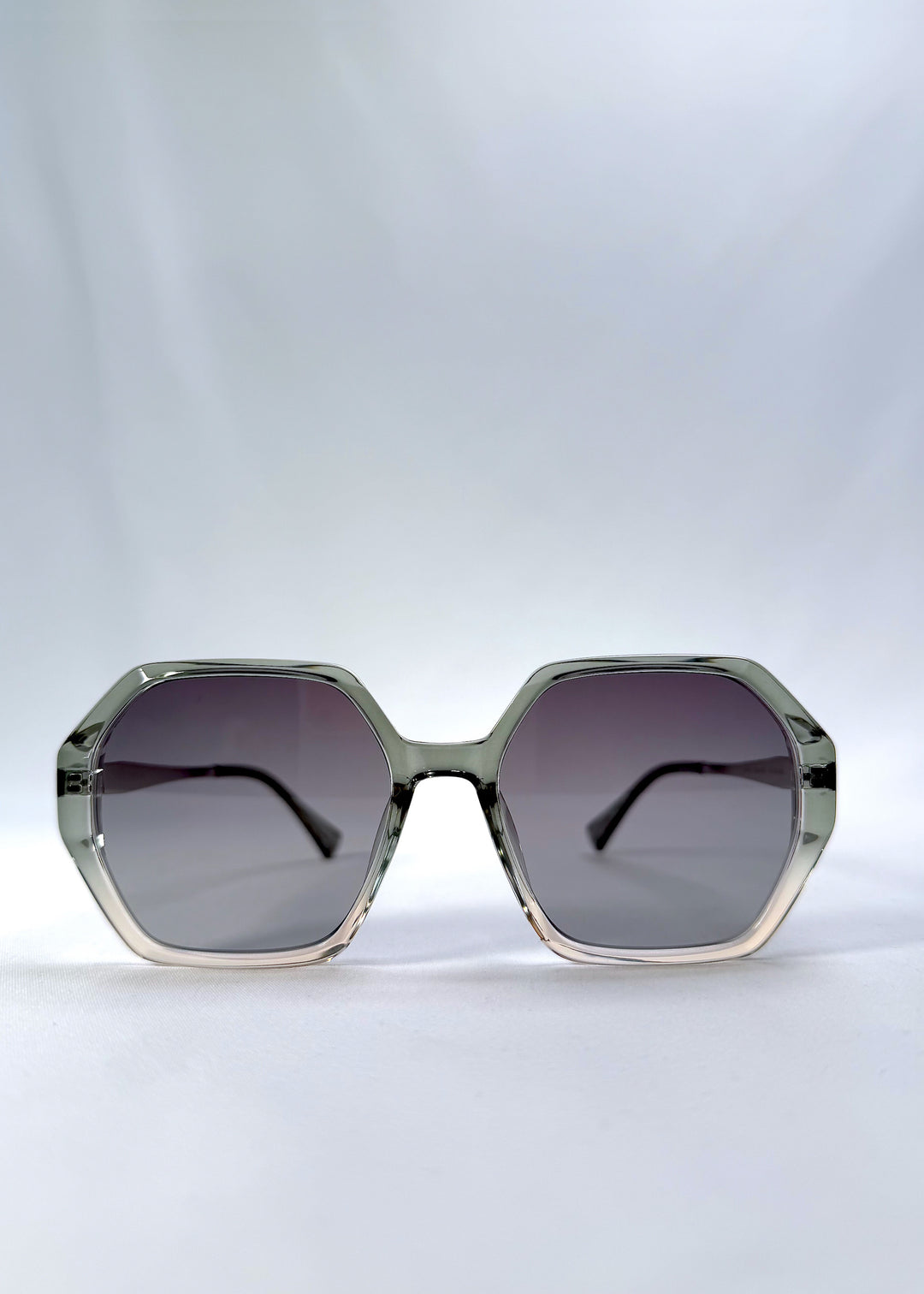 Front view of Ciel Arc sunglasses in Jade Phase, featuring green-toned frame and smoky green lenses, showing the full front silhouette.