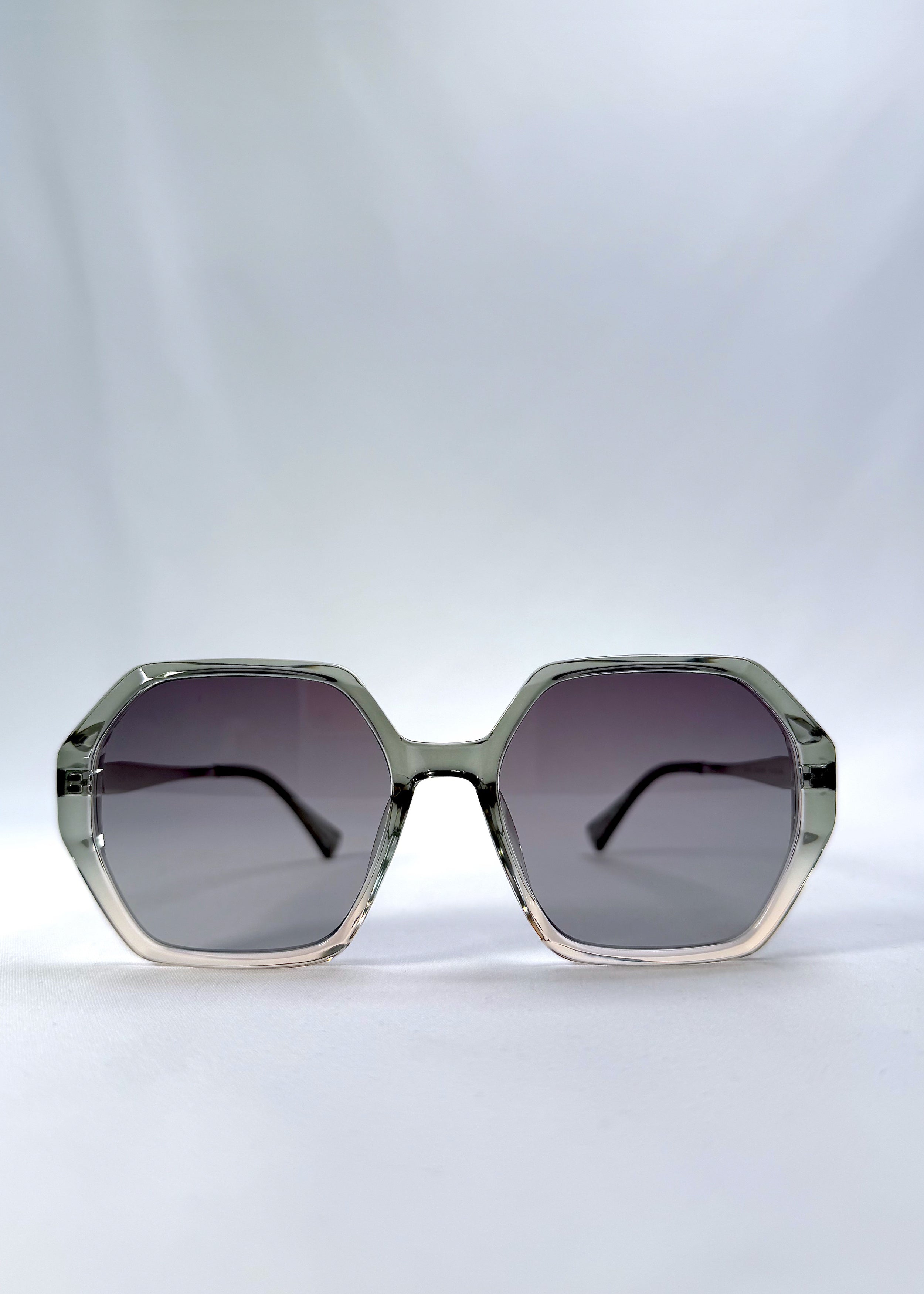 Front view of Ciel Arc sunglasses in Jade Phase, featuring green-toned frame and smoky green lenses, showing the full front silhouette.