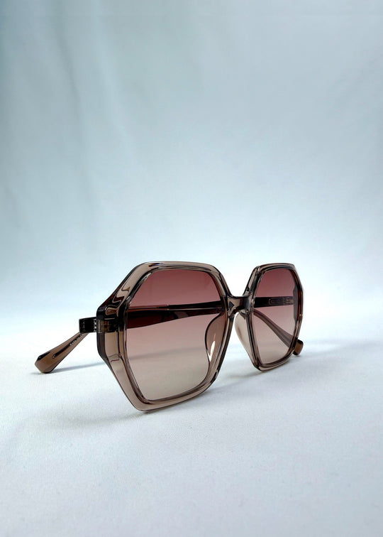 Back-angle view of Ciel Arc sunglasses in Mocha Bronze, featuring mocha bronze frame and warm brown gradient lenses, showing the back structure and temple alignment. 