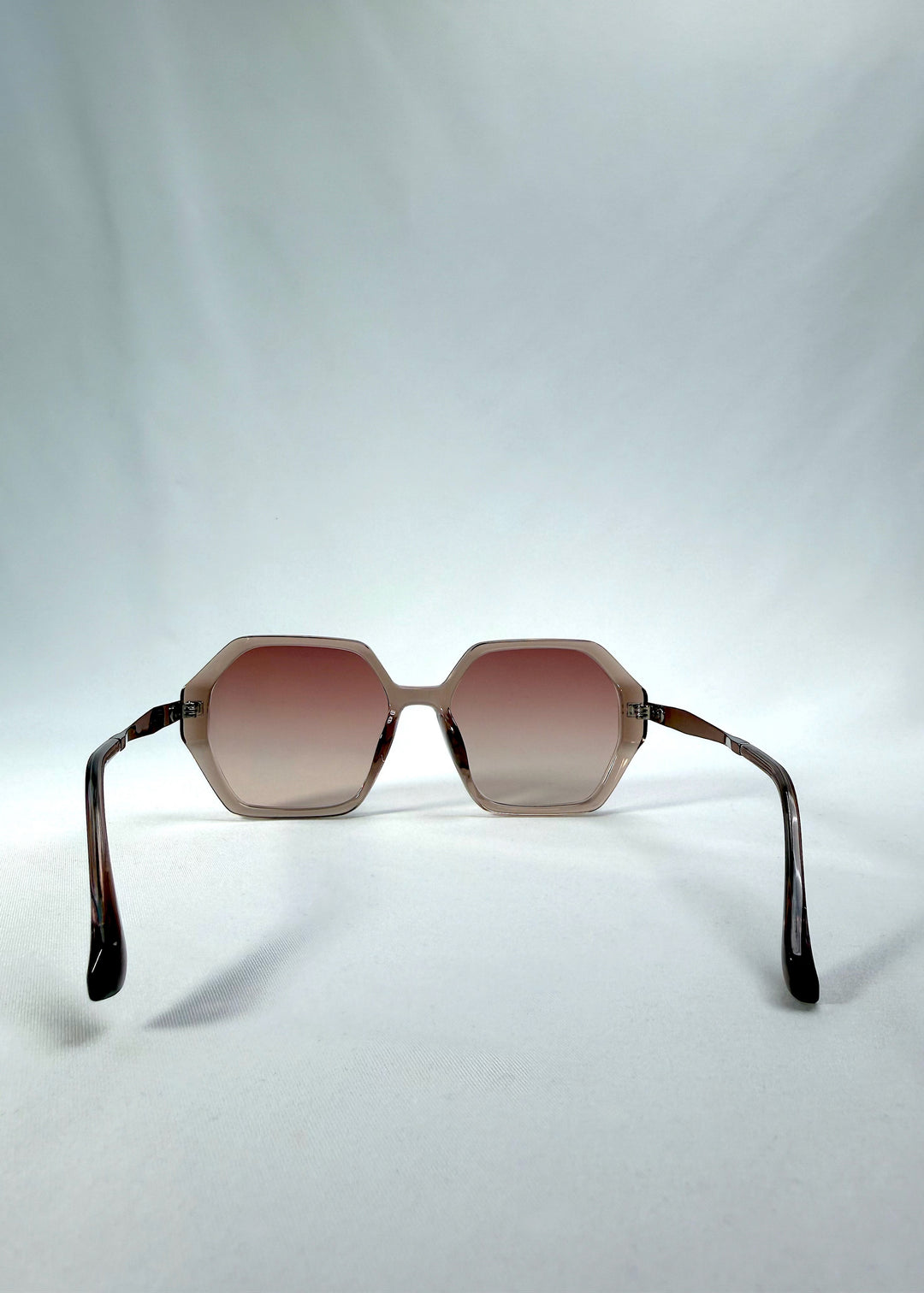 Back view of Ciel Arc sunglasses in Mocha Bronze, featuring mocha bronze frame and warm brown gradient lenses, showing the inside frame and open temples.