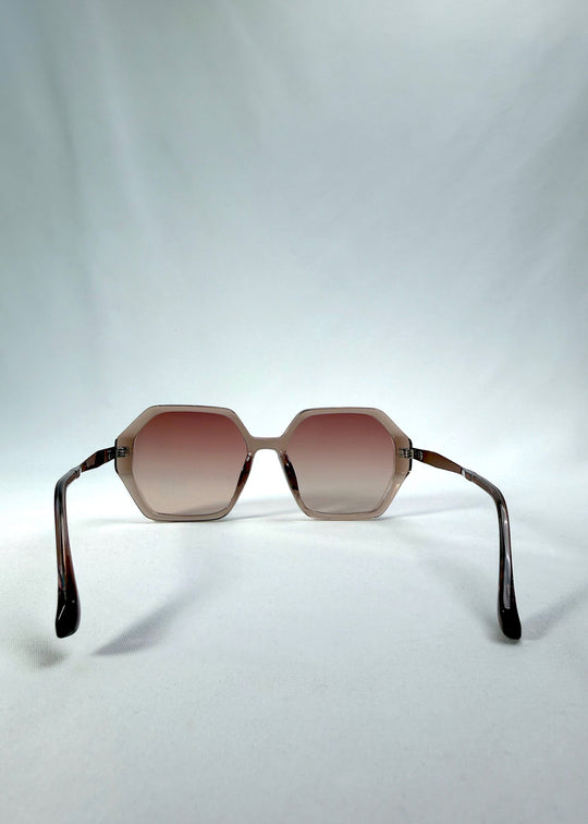 Back view of Ciel Arc sunglasses in Mocha Bronze, featuring mocha bronze frame and warm brown gradient lenses, showing the inside frame and open temples. 