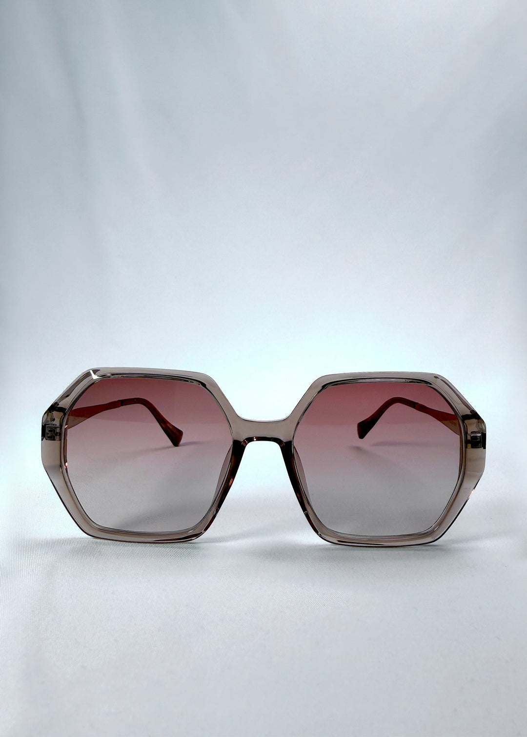 Front view of Ciel Arc sunglasses in Mocha Bronze, featuring mocha bronze frame and warm brown gradient lenses, showing the full front silhouette. 