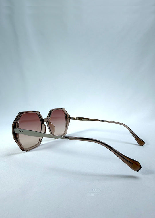 Side-angle view of Ciel Arc sunglasses in Mocha Bronze, featuring mocha bronze frame and warm brown gradient lenses, showing the lens shape and side temple profile. 