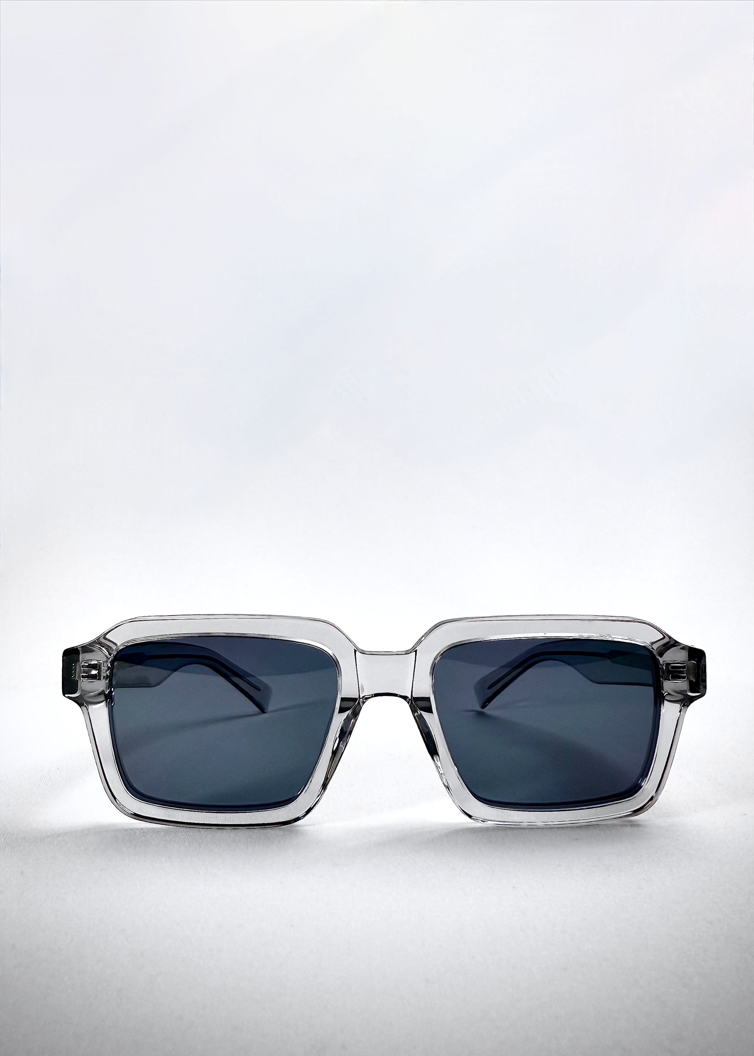 Front view of Crest - Glacier sunglasses showcasing the squared translucent frame and icy blue polarized lenses.