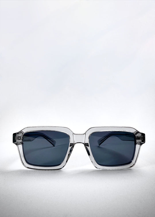 Front view of Crest - Glacier sunglasses showcasing the squared translucent frame and icy blue polarized lenses. 