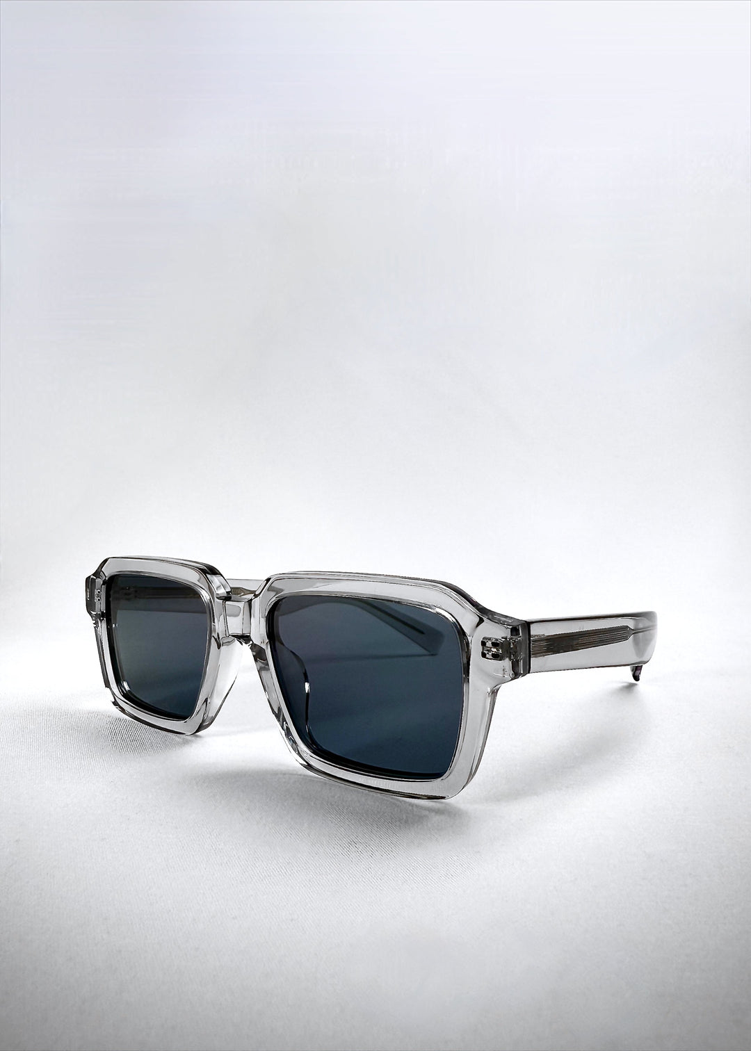Angled right-side view of Crest - Glacier sunglasses, revealing the clean silhouette and frosted crystal acetate finish. 