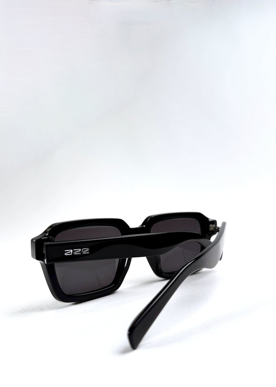 Side-back view of Crest - Obsidian Black sunglasses displaying the sleek temple arms and ergonomic fit. 