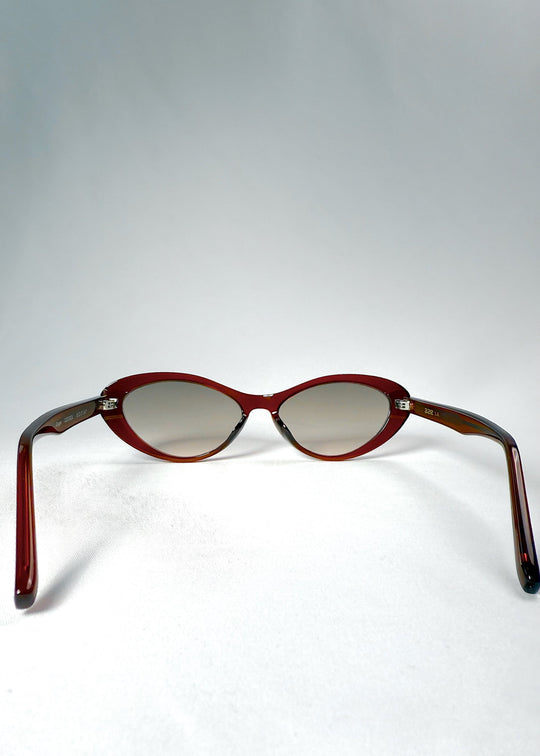 Back view of Dagger sunglasses in Crimson Mist showing the fixed nose bridge and open temples. 