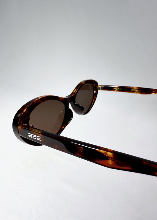 Close-up angled shot of the frame highlighting the acetate texture and cat-eye contour (Dagger, Ember Fade). 