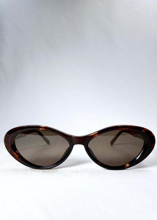 Front view of Dagger in Ember Fade sunglasses showcasing the cat-eye silhouette and tortoiseshell frame. 