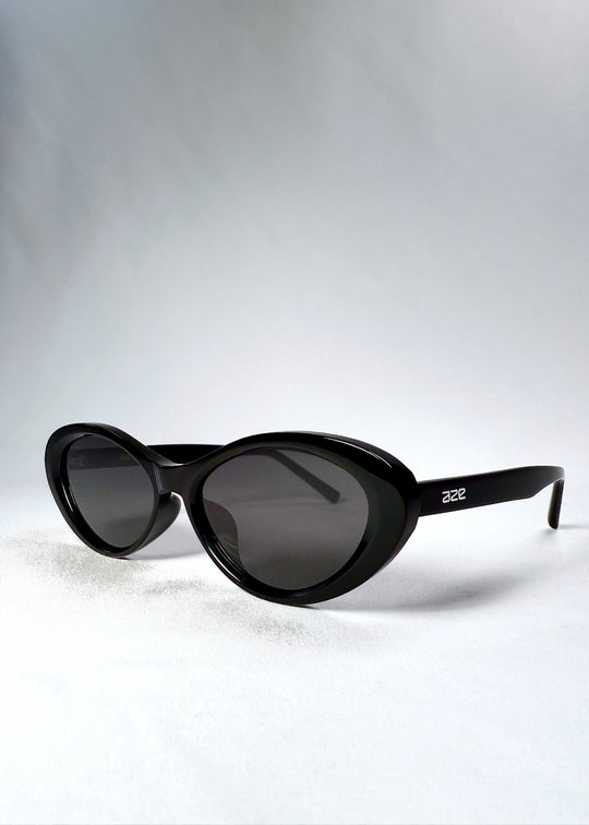 Front-angle view of Dagger in Obsidian Black featuring glossy acetate frame and bold cat-eye shape. 