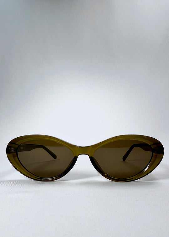 Front view of Dagger sunglasses in Olive Shadow with bold cat-eye silhouette and dark nylon lenses. 