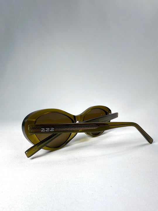 Inside view of Dagger sunglasses in Olive Shadow with clear display of interior acetate texture and hinge placement. 