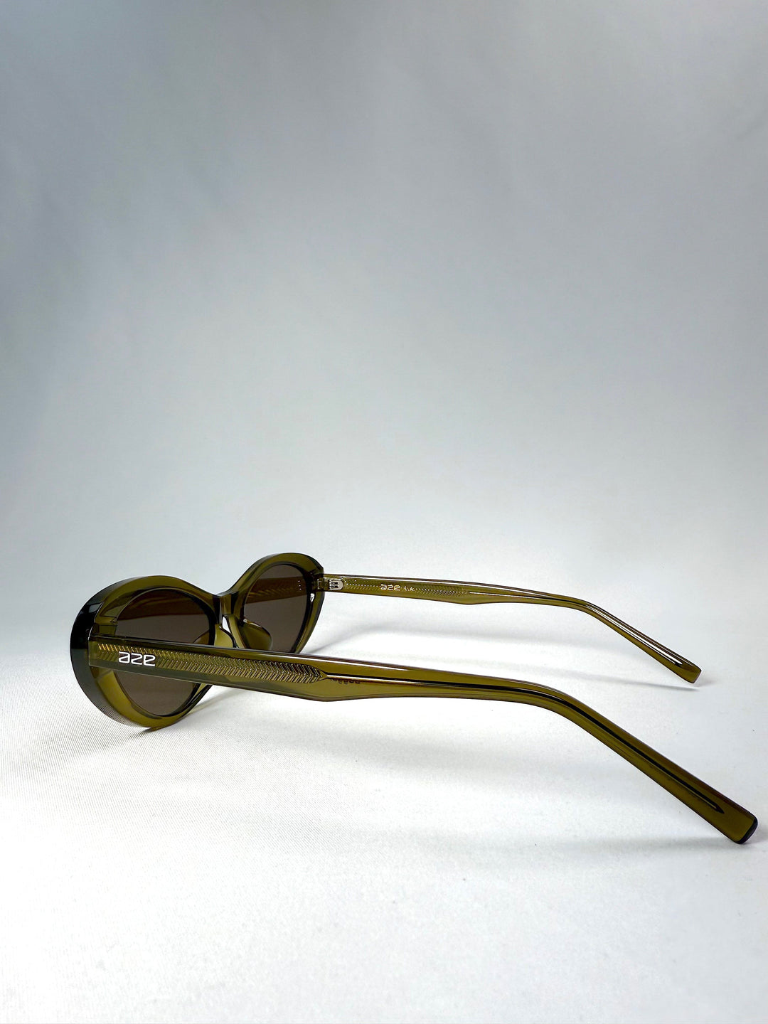 Side view of Dagger sunglasses in Olive Shadow showcasing the tapered temple arms and sculpted frame profile. 