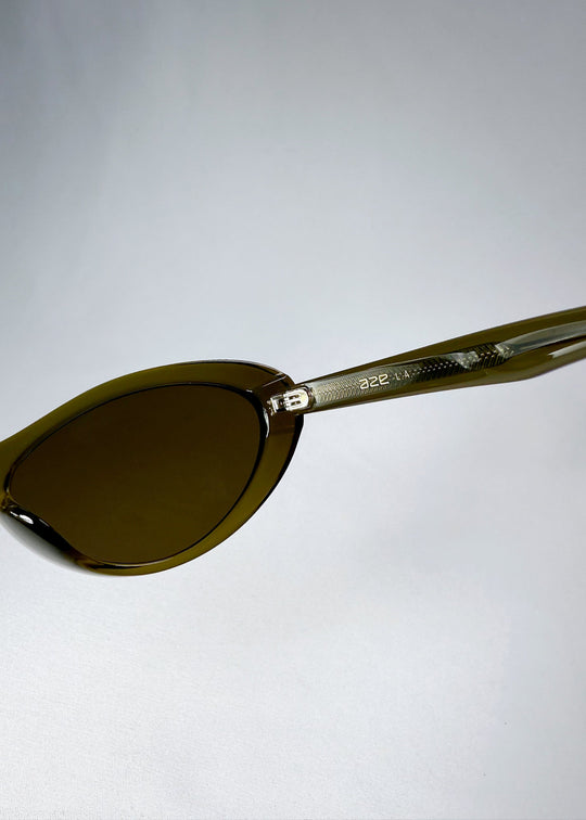 Close-up of Dagger’s temple in Olive Shadow revealing engraved metal core and Aze logo detailing. 