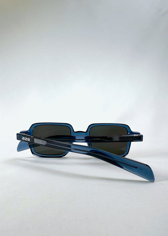 Folded view of Draxen in Glacial Blue, displaying both temples and the lightweight construction. 