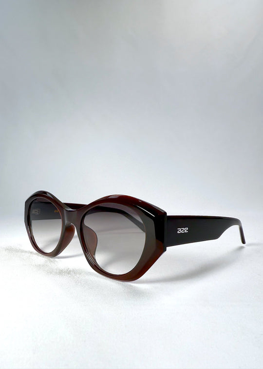 Eclipse Feline in Crimson Mirage shown from a front angle, highlighting its sculptural curves and bold cat-eye silhouette. 