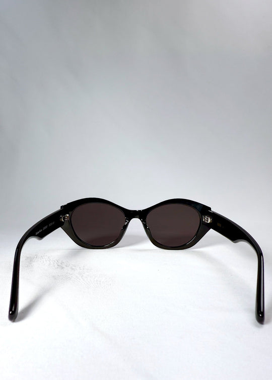 Back view of Eclipse Feline sunglasses showing the frame curvature and fixed-fit temples. 