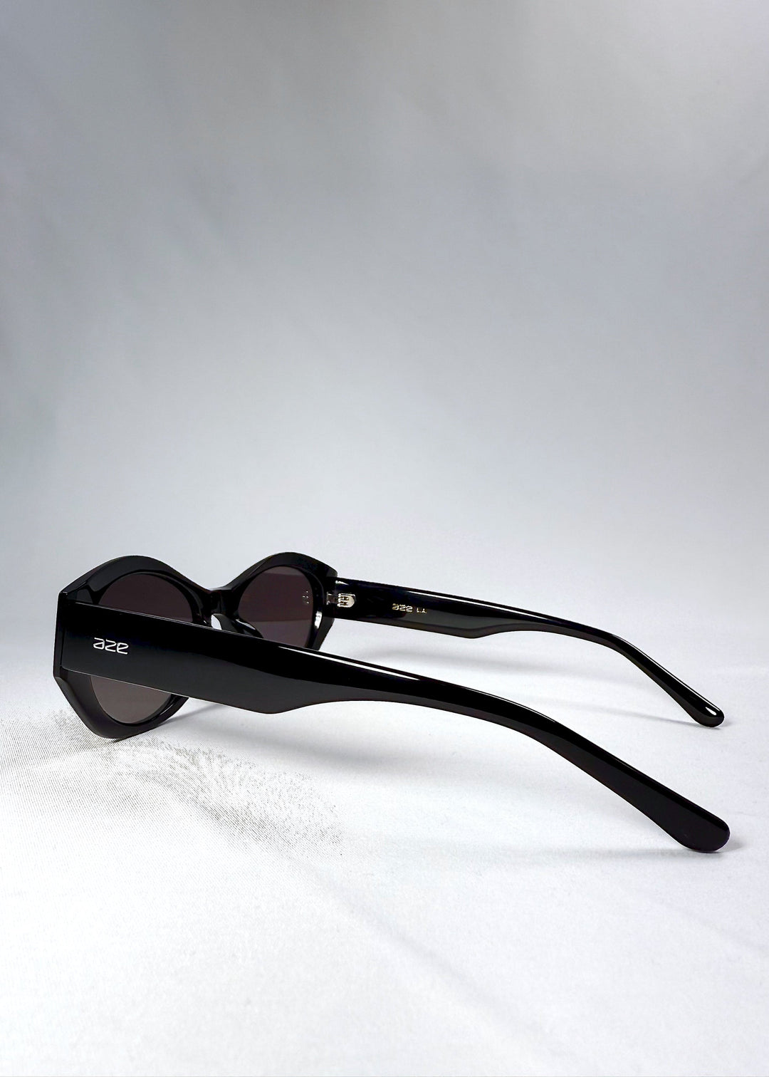 Side profile of Eclipse Feline in Obsidian Black, highlighting the sleek acetate temples with engraved Aze branding. 