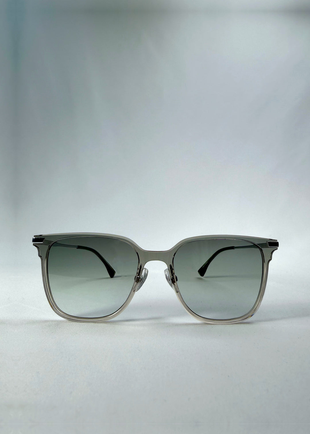 Front view of Eon Drift sunglasses in Olive Shadow, featuring a translucent olive-gray frame and gray gradient lenses, showing the full front silhouette.