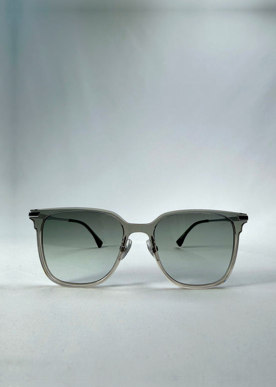 Front view of Eon Drift sunglasses in Olive Shadow, featuring a translucent olive-gray frame and gray gradient lenses, showing the full front silhouette.