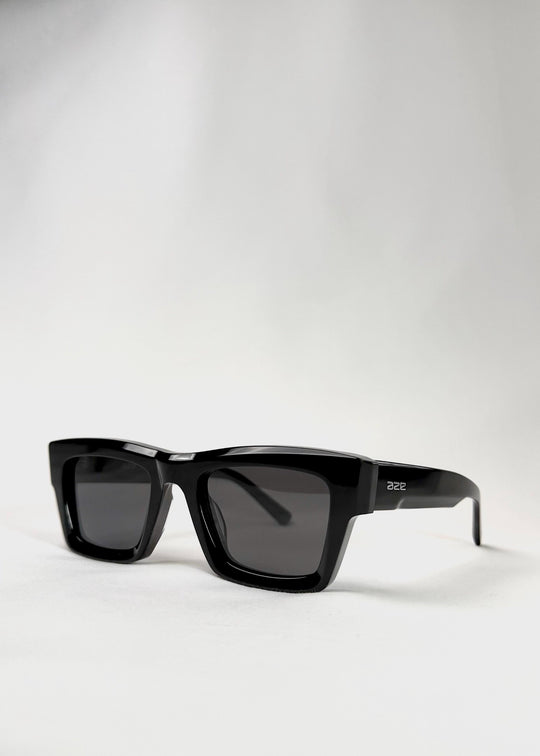 Angled view of Fomalhaut black acetate prescription sunglasses highlighting its bold frame. 