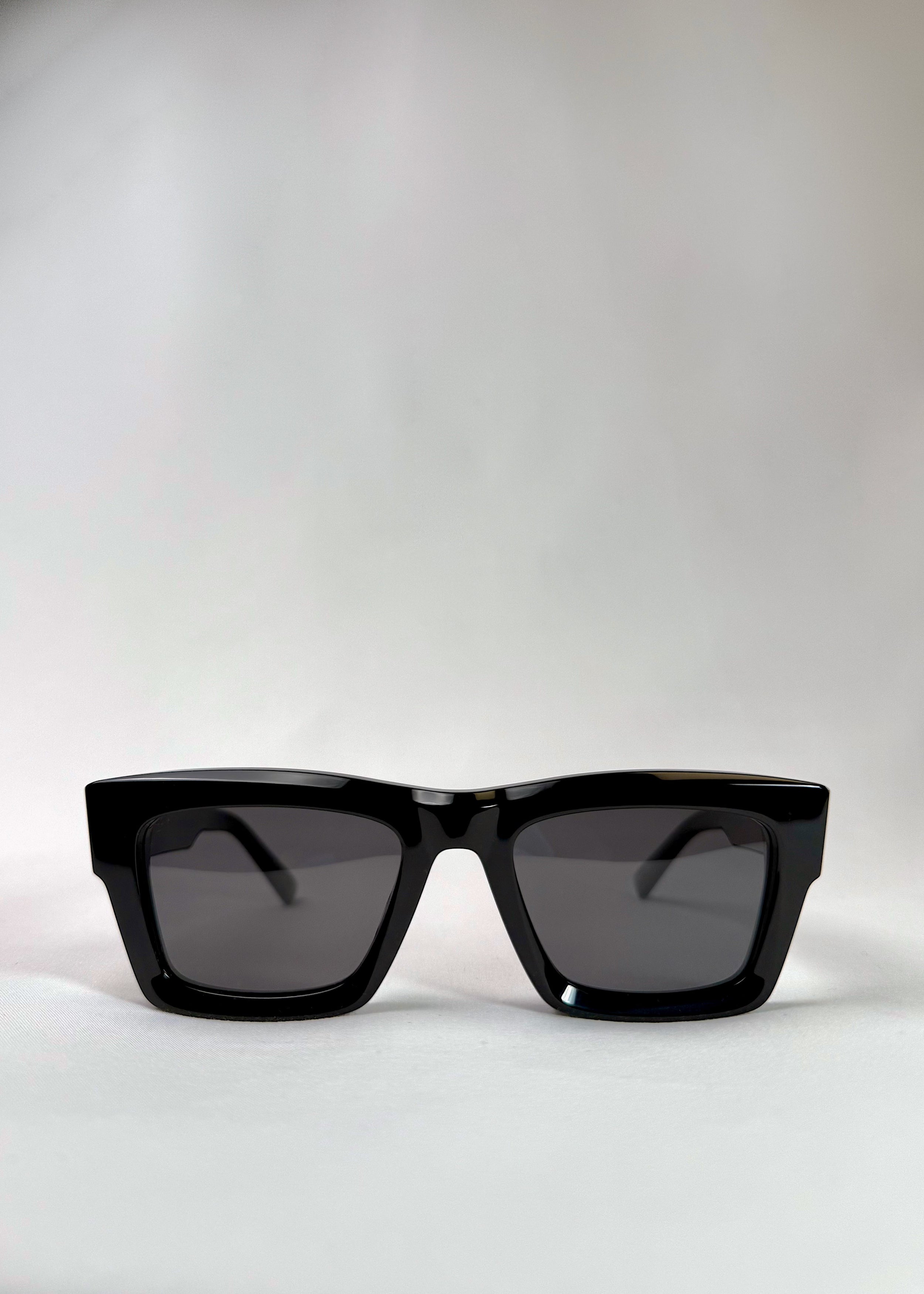 Front view of Fomalhaut black acetate prescription sunglasses with UV400 polarized lenses.