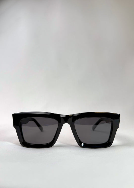 Front view of Fomalhaut black acetate prescription sunglasses with UV400 polarized lenses. 
