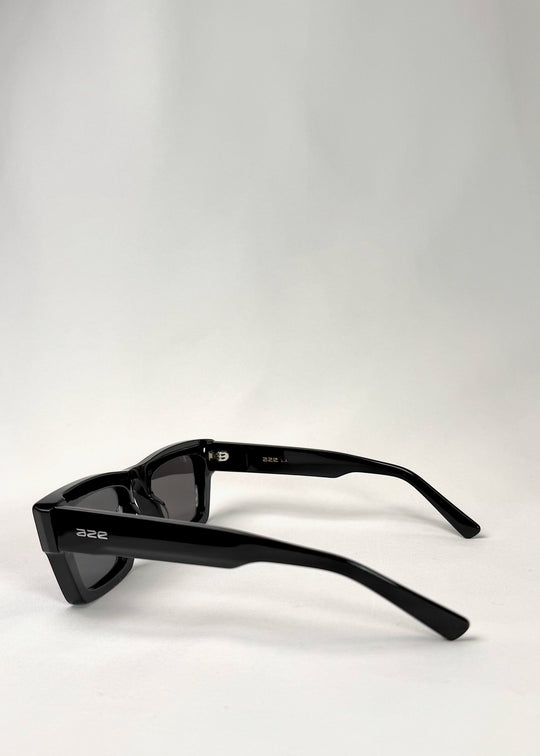 Side profile of Fomalhaut black acetate prescription sunglasses showcasing the sleek temple design. 