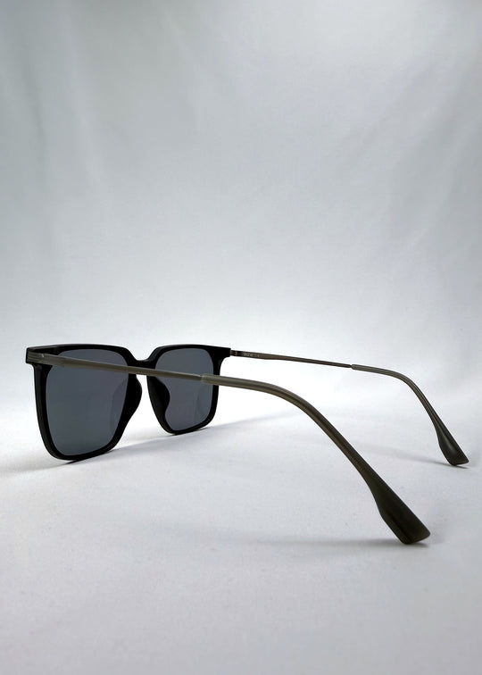 Side-angle view of Gemini sunglasses in Matte Black, featuring light titanium frame, squared lens shape, and polarized lenses, showing the lens shape and temple profile.