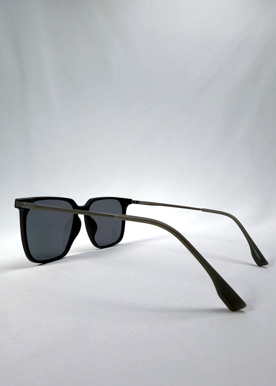 Side-angle view of Gemini sunglasses in Matte Black, highlighting the slim titanium temples and curved temple tips. 