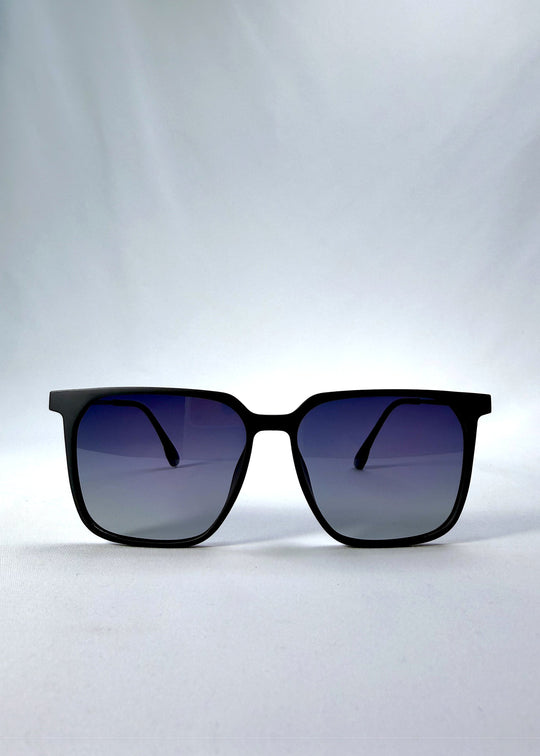 Front view of Gemini sunglasses in Matte Blue, showing the full squared frame and polarized lenses. 