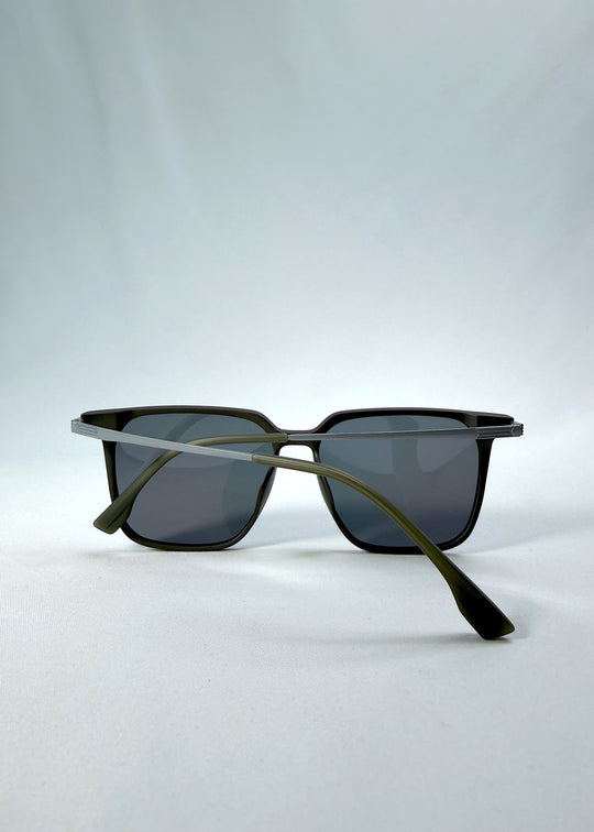 Folded view of Gemini sunglasses in Matte Gray, featuring light titanium frame, squared lens shape, and polarized lenses, showing the folded temples and frame profile.