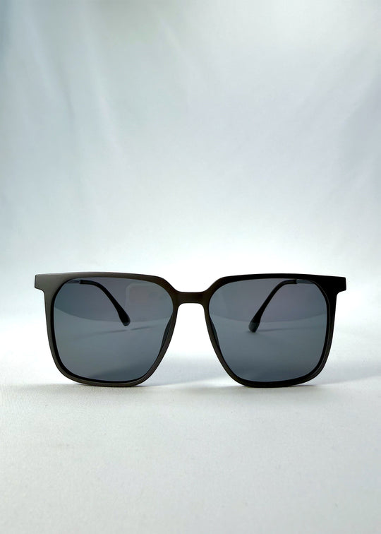 Front view of Gemini sunglasses in Matte Gray, featuring light titanium frame, squared lens shape, and polarized lenses, showing the full front silhouette.