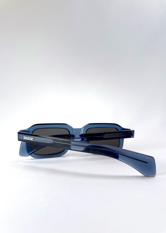Rear diagonal view of Havoc in Abyss Azure, showcasing the translucent blue acetate frame and wide temples with subtle gradient tones. 