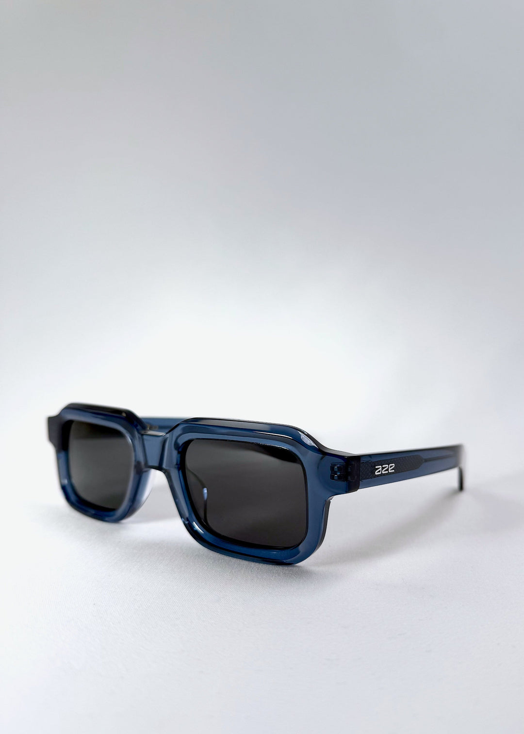 Front angle of Havoc in Abyss Azure, emphasizing the sculpted acetate construction and blue transparency. 