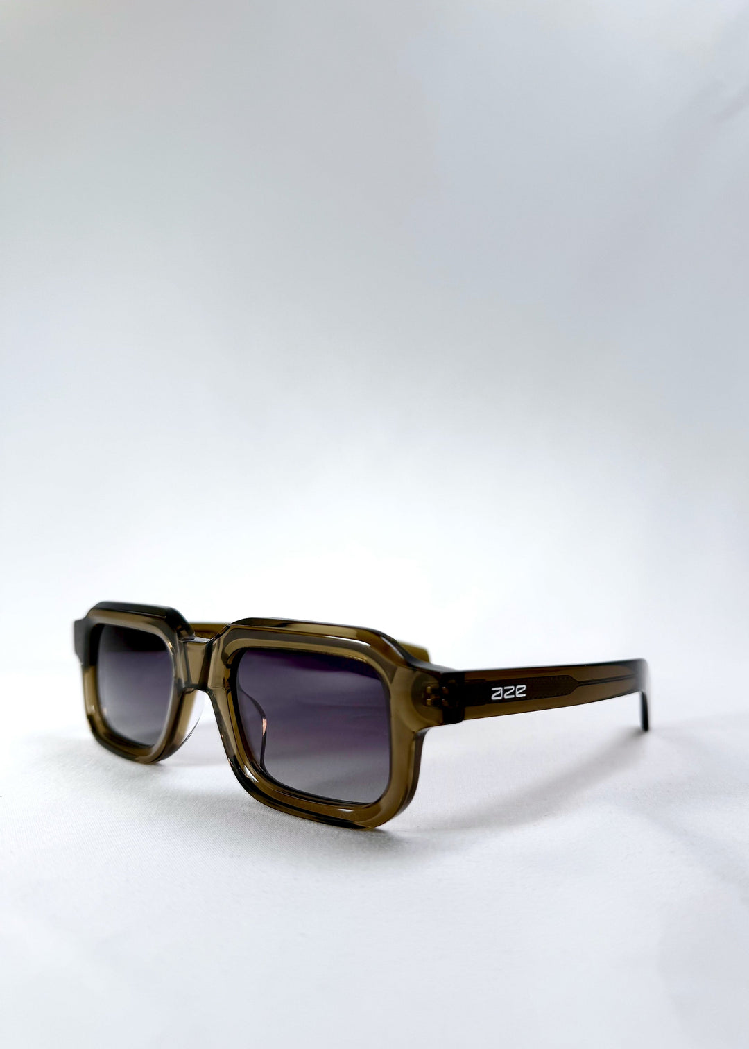 Front-angle view of Havoc in Ember Fade, highlighting the frame depth and the gradient in the lenses. 