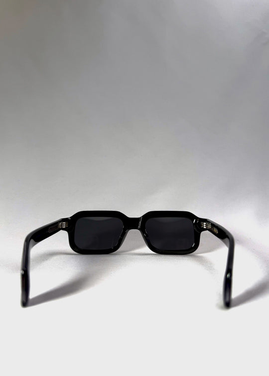 Back view of Havoc in Obsidian Black, showcasing its rectangular silhouette and wide acetate temples. 
