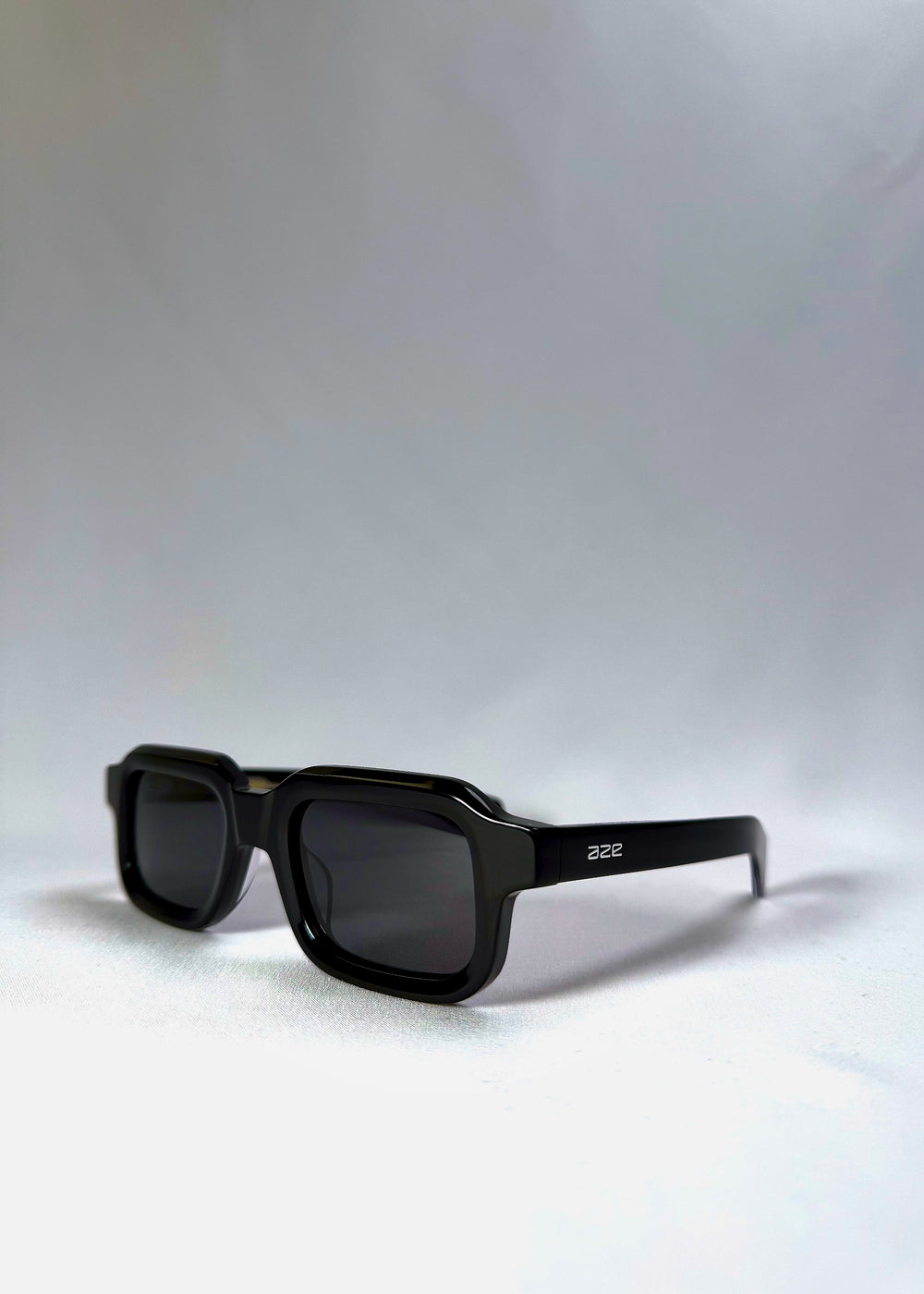 Havoc in Obsidian Black shown from a front angle, highlighting its squared frame and sculpted acetate finish.