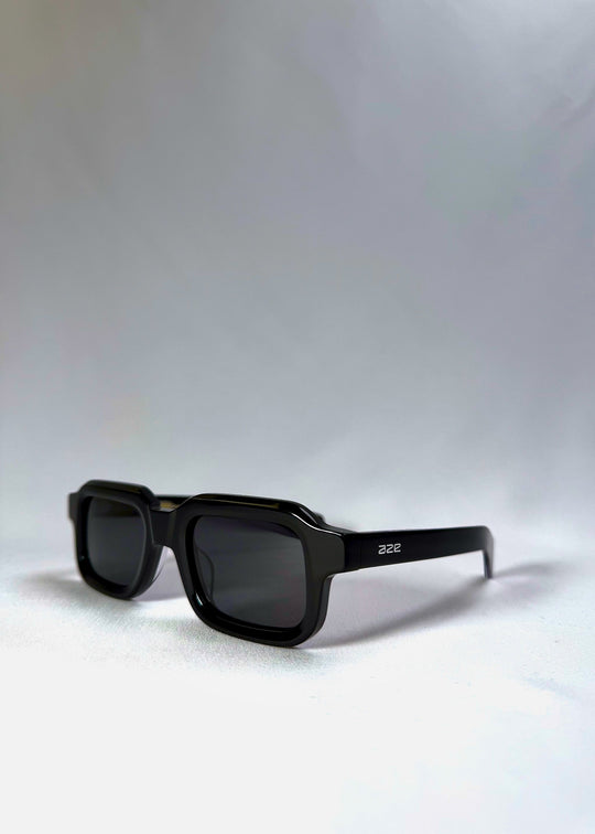 Havoc in Obsidian Black shown from a front angle, highlighting its squared frame and sculpted acetate finish. 
