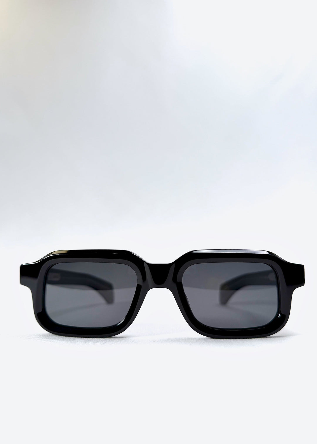 Front view of Havoc in Obsidian Black, featuring a bold rectangular frame with dark polarized lenses, designed for a confident and minimalist look. 
