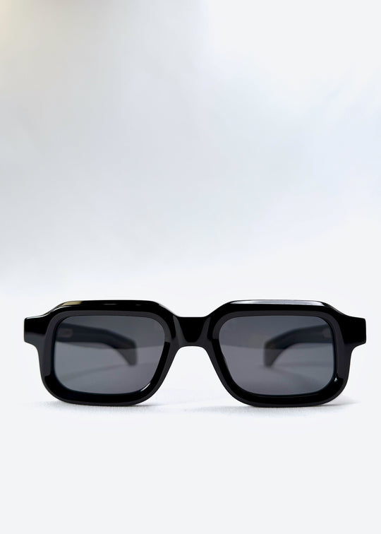 Front view of Havoc in Obsidian Black, featuring a bold rectangular frame with dark polarized lenses, designed for a confident and minimalist look. 