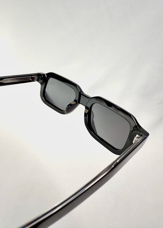 Detailed shot of the lens and nose bridge of Havoc in Obsidian Black, showing the smooth contours and seamless acetate craftsmanship. 